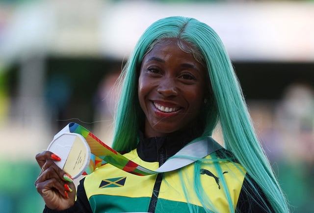 Athletics - World Athletics Championships - Women's 100 Metres - Final - Hayward Field, Eugene, Oregon, U.S. - July 18, 2022 Gold Medallist Jamaica's Shelly-Ann Fraser-Pryce celebrates on the podium during the medal ceremony REUTERS/Brian Snyder/File Photo