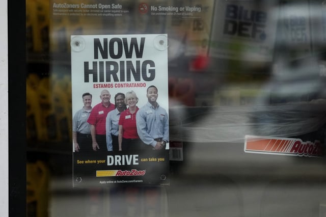 FILE - A hiring sign is displayed at a retail store in Buffalo Grove, Ill., Wednesday, Nov. 6, 2024. (AP Photo/Nam Y. Huh, File)