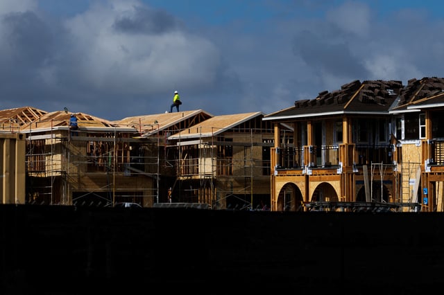 A construction worker pauses for a rest as he helps build residential homes in Irvine, California, U.S., March 28, 2025.  REUTERS/Mike Blake/File Photo