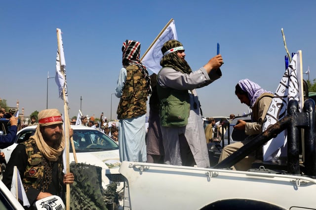 Members of the Taliban participate in a rally to mark the third anniversary of the fall of Kabul, in Kabul, Afghanistan, August 14, 2024. REUTERS/Sayed Hassib/File Photo