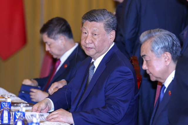 Chinese President Xi Jinping, center, attends a meeting with Vietnamese President Luong Cuong, unseen, at the Presidential Palace in Hanoi, Vietnam, Tuesday, April 15, 2025.