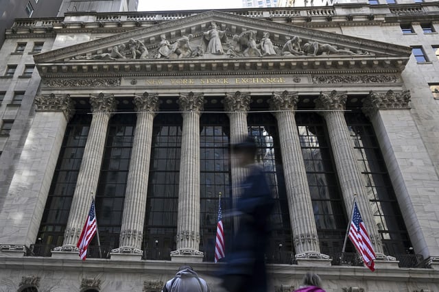 US stocks were mixed Thursday morning as President Donald Trump lashed out at Federal Reserve Chair Jerome Powell on social media.