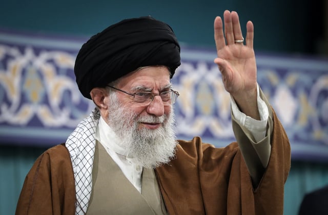 In this photo released by the official website of the office of the Iranian supreme leader, Supreme Leader Ayatollah Ali Khamenei waves to the crowd during a meeting with officials, Islamic countries&#39; ambassador to Iran and a group of people in Tehran, Iran, Monday, March 31, 2025.