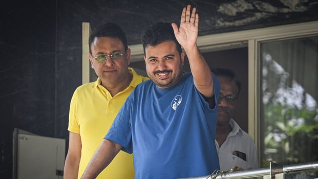 AAP leader Durgesh Pathak seen outside his house after reports of CBI raid at his residence.