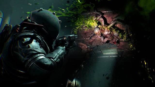 The player character in Cronos aims a gun at a horrifying monster on the wall.