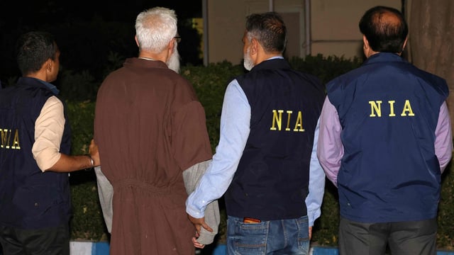National Investigation Agency (NIA) officials along with Tahawwur Hussain Rana.