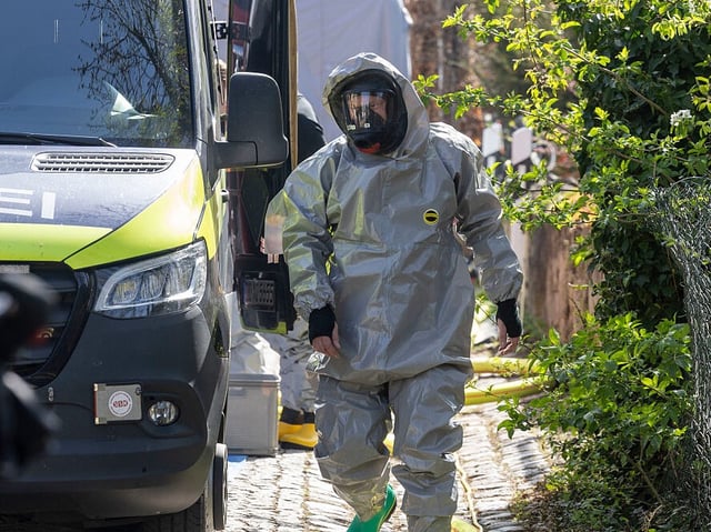 17 April 2025, Saxony, Zeithain: A firefighter in a protective suit prepares for his mission after the Dresden public prosecutor's office and the Saxony State Criminal Police Office investigated a 16-year-old German on suspicion of violating the War Weapons Control Act and ordered a raid. He is said to have produced several ampoules of a mixture of aconitine and ricin in the laboratory set up in the attic of his parents' house. Photo: Daniel Wagner/dpa (Photo by Daniel Wagner/picture alliance via Getty Images)