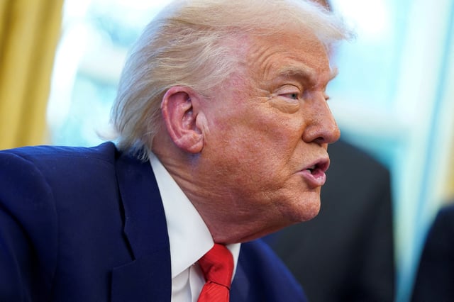 U.S. President Donald Trump speaks, as he signs executive orders and proclamations in the Oval Office at the White House in Washington, D.C., U.S., April 9, 2025. REUTERS/Nathan Howard/File Photo