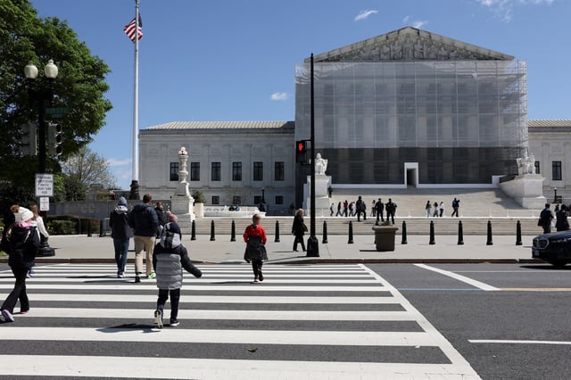 People walk near the U.S. Supreme Court building in Washington, D.C., U.S., April 8, 2025. REUTERS/Jonathan Ernst/File Photo