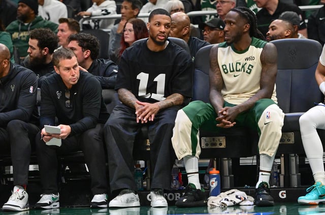 Apr 10, 2025; Milwaukee, Wisconsin, USA;  Milwaukee Bucks guard Damian Lillard (middle) sits on the bench with an injury against the New Orleans Pelicans at Fiserv Forum. Mandatory Credit: Benny Sieu-Imagn Images/File photo