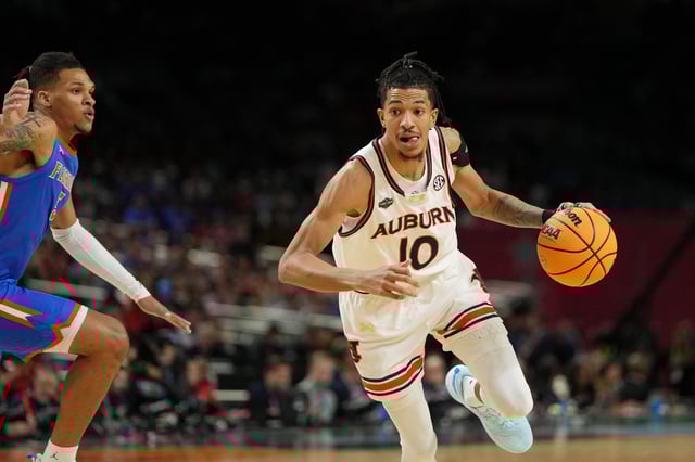 Apr 5, 2025; San Antonio, TX, USA; Auburn Tigers guard Chad Baker-Mazara (10) drives to the basket against the Florida Gators during the first half in the semifinals of the men's Final Four of the 2025 NCAA Tournament at the Alamodome. Mandatory Credit: Bob Donnan-Imagn Images/File photo