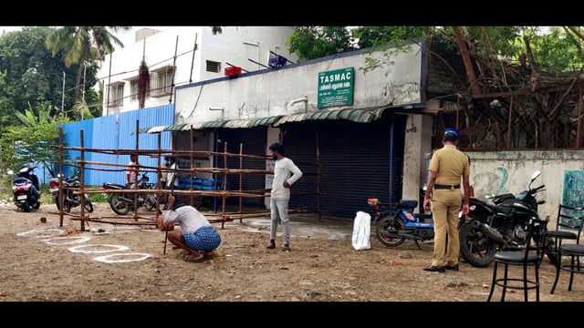 Tamil Nadu, June 14 (ANI): Tasmac officials are preparing social distancing circle marks outside government run Tasmac wine shop before opening after the lockdown imposed in Chennai on Monday. (ANI Photo) (ANI)