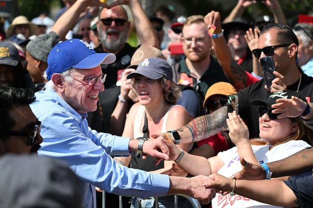 Sen. Bernie Sanders, I-Vt., with supporters after speaking at the "Fighting Oligarchy" rally in Los Angeles on April 12, 2025. 