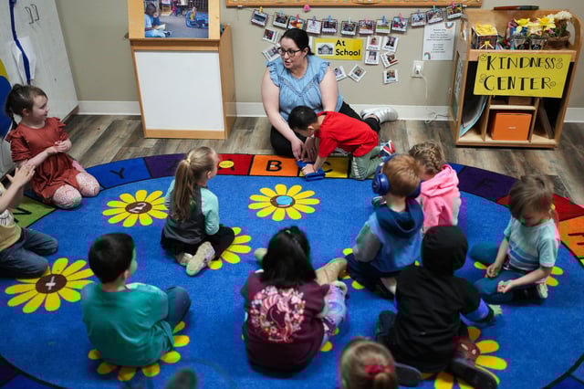 FILE - Family Educator Lisa Benson-Nuyen, addresses her students in a circle in the Northern Lights classroom at the Meadow Lakes CCS Early Learning, a Head Start center, Monday, May 6, 2024, in Wasilla, Alaska. (AP Photo/Lindsey Wasson, File)