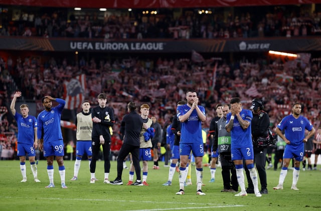Soccer Football - Europa League - Quarter Final - Second Leg - Athletic Bilbao v Rangers - San Mames, Bilbao, Spain - April 17, 2025 Rangers' James Tavernier looks dejected as John Souttar applauds fans after the match REUTERS/Vincent West
