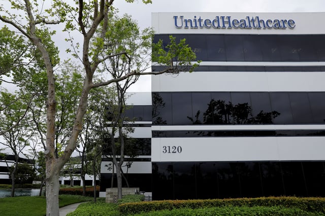 The corporate logo of the UnitedHealth Group appears on the side of one of their office buildings in Santa Ana, California, U.S., April 13, 2020.      REUTERS/Mike Blake/File Photo