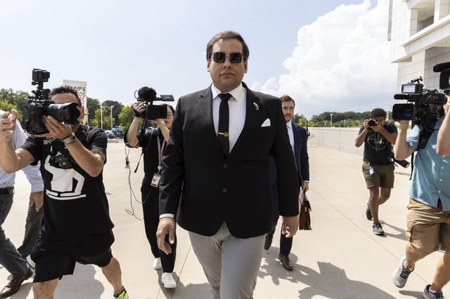 FILE - Former U.S. Rep. George Santos arrives at court in Central Islip, N.Y., Aug. 19, 2024. (AP Photo/Stefan Jeremiah, File)