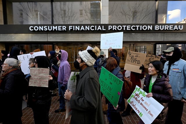 Supporters of the Consumer Financial Protection Bureau rally after Acting Consumer Financial Protection Bureau Director Russell Vought told all of the agency's staff to stay away from the office and do no work, outside the CFPB in Washington, U.S., February 10, 2025. REUTERS/Craig Hudson/File Photo