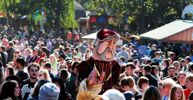 The closing weekend for the Minnesota Renaissance Festival saw near perfect Saturday, Oct. 1, 2016, in Shakopee, MN. Here, King Bubba of the Puppet Troupe towers above the large crowd.