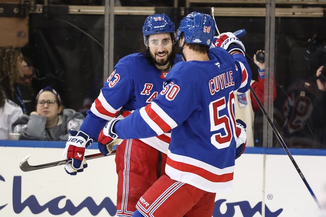 Apr 17, 2025; New York, New York, USA;  New York Rangers center Mika Zibanejad (93) celebrates with left wing Will Cuylle (50) after scoring a goal in the third period against the Tampa Bay Lightning at Madison Square Garden. Mandatory Credit: Wendell Cruz-Imagn Images