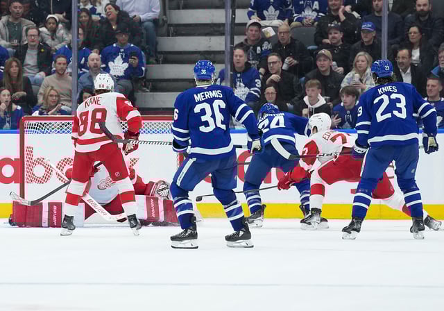 Apr 17, 2025; Toronto, Ontario, CAN; Toronto Maple Leafs left wing Scott Laughton (24) scores a goal against the Detroit Red Wings during the overtime  period at Scotiabank Arena. Mandatory Credit: Nick Turchiaro-Imagn Images