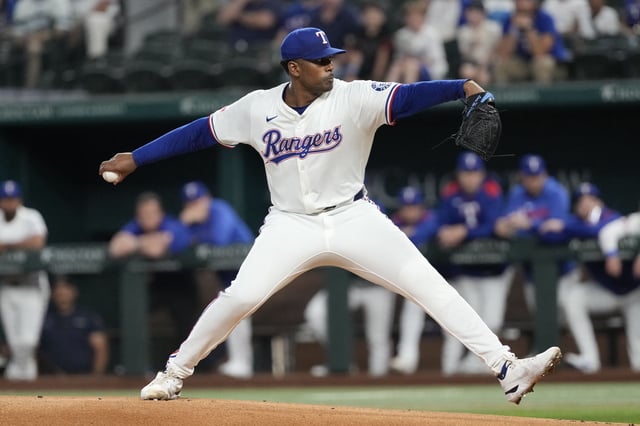 Apr 17, 2025; Arlington, Texas, USA; Texas Rangers starting pitcher Kumar Rocker (80) delivers a pitch to the Los Angeles Angels during the first inning at Globe Life Field. Mandatory Credit: Jim Cowsert-Imagn Images
