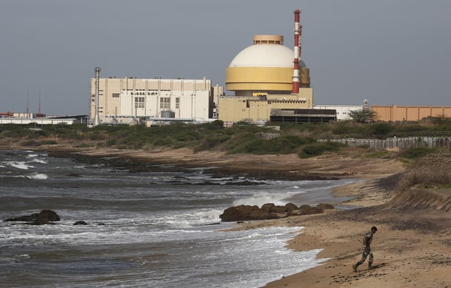 File Photo: A policeman walks on a beach near Kudankulam nuclear power project in the southern Indian state of Tamil Nadu September 13, 2012. REUTERS/Adnan Abidi/File Photo