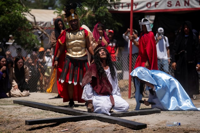 Filipino Catholic Ruben Enaje kneels on the ground during his reenactment of the crucifixion of Jesus Christ on Good Friday, in San Fernando, Philippines, April 18, 2025. REUTERS/Lisa Marie David