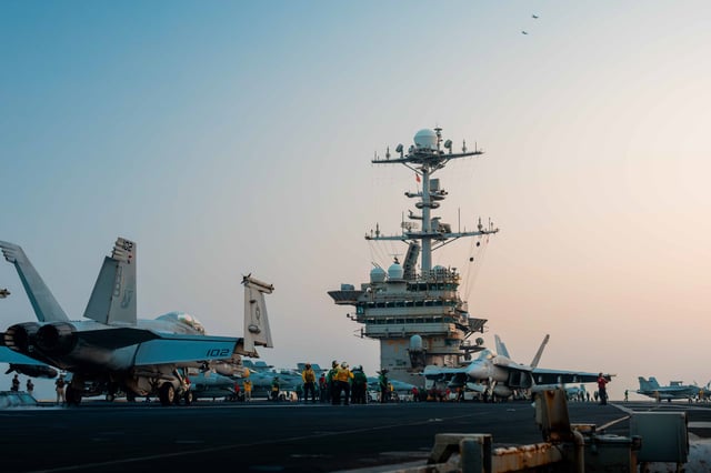 An F/A-18F Super Hornet prepares to launch from the flight deck of the Nimitz-class aircraft carrier USS Harry S. Truman on March 18, 2025