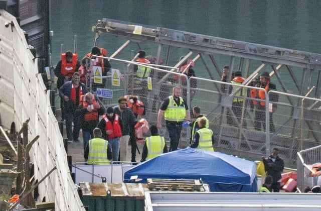 A group of people thought to be migrants are brought in to Dover. Photo credit should read: Gareth Fuller/PA Wire