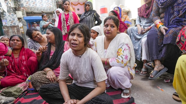 Relatives grieve after a 17-year-old boy was stabbed to death in Delhi's Seelampur area.
