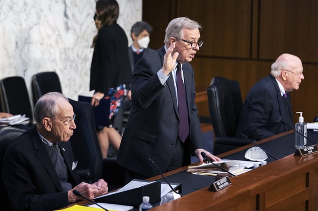 FILE - Senate Judiciary Committee Chairman Sen. Dick Durbin, D-Ill., with ranking member Sen. Chuck Grassley, R-Iowa, left, and Sen. Patrick Leahy, D-Vt., right, swears in Assistant Attorney General for National Security Division Matthew Olsen and Executive Assistant Director, National Security Branch of the FBI Jill Sanborn during the committee hearing to examine the domestic terrorism threat one year after January 6, on Capitol Hill, Feb. 10, 2022, in Washington. (AP Photo/Manuel Balce Ceneta, File)