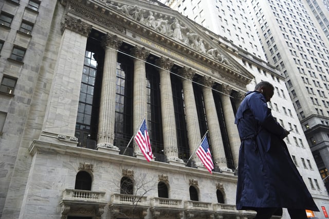 A pedestrian walks past the New York Stock Exchange on the Wall Street on April 3, 2025, in New York, New York. NYSE is closed on Good Friday 2025, though it is not classified as a federal holiday.