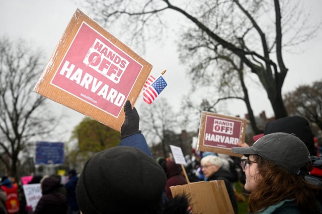 Demonstrators rally on Cambridge Common in a protest organized by the City of Cambridge calling on Harvard leadership to resist interference at the university by the federal government in Cambridge, Massachusetts, U.S. April 12, 2025.   REUTERS/Nicholas Pfosi/File Photo