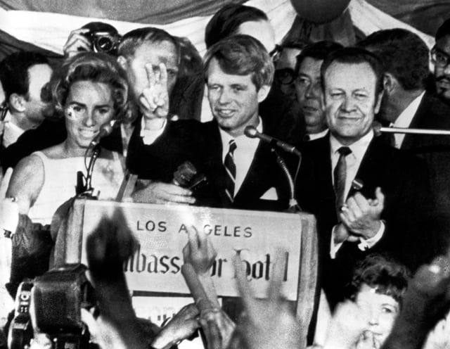 FILE - Sen. Robert F. Kennedy, D-N.Y., speaks to campaign workers, June 5, 1968, as his wife Ethel, left, and California campaign manager and speaker of the California Assembly, Jesse Unruh, look on, at the Ambassador Hotel in Los Angeles. (AP Photo)