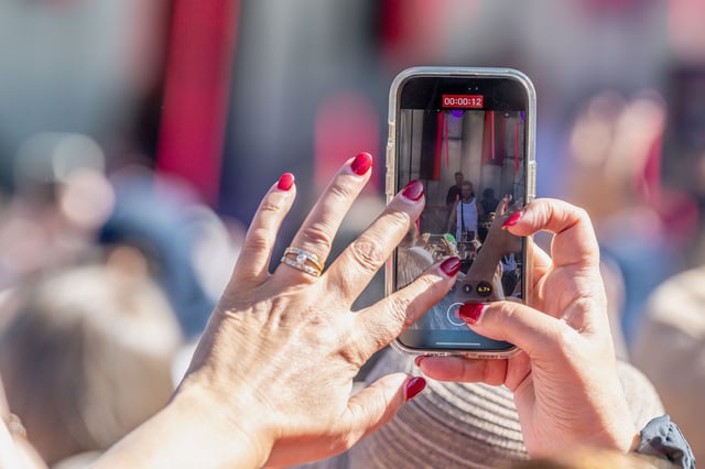 A fan captures Robbie Williams as he gives a performance in Melbourne, Australia, in January.