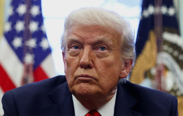 U.S. President Donald Trump looks on on the day he signs executive orders in the Oval Office at the White House in Washington, D.C., U.S., April 17, 2025. REUTERS/Evelyn Hockstein