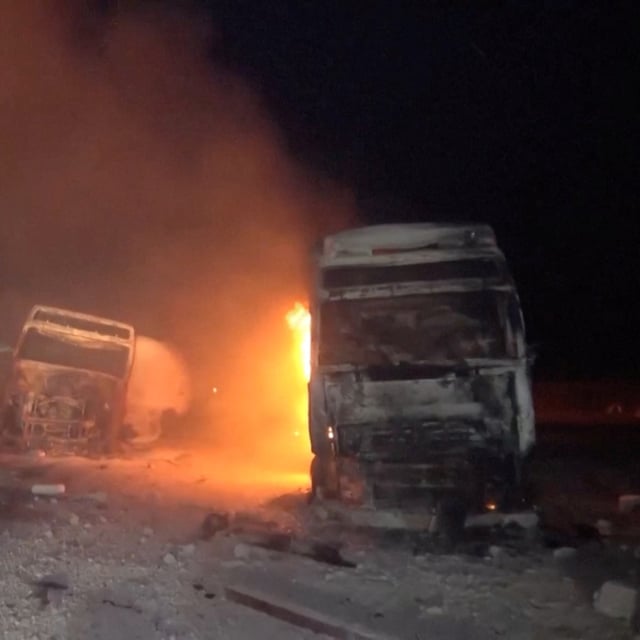 Fire and smoke rise next to charred vehicles following, what Al Masirah TV said, was a U.S. strike on the Ras Isa fuel port, Yemen, in this screengrab from a handout video released on April 18, 2025. Al-Masirah TV /Handout via REUTERS    THIS IMAGE HAS BEEN SUPPLIED BY A THIRD PARTY. NO RESALES. NO ARCHIVES