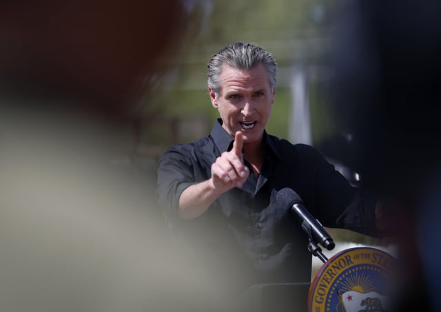California Governor Gavin Newsom speaks during a news conference at Gemperle Orchard on April 16, 2025 in Ceres, California.