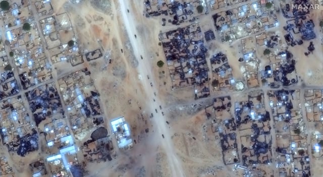 This satellite image released by Maxar Technologies shows blackened buildings in Darfur's Zamzam camp as Sudanese paramilitaries move through.