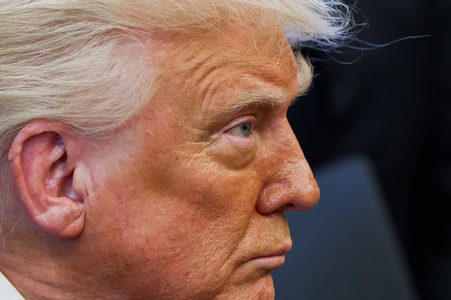 U.S. President Donald Trump looks on on the day he signs executive orders in the Oval Office at the White House in Washington, D.C., U.S., April 17, 2025. REUTERS/Evelyn Hockstein
