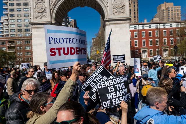 People rally and march in support of universities and education on April 17, 2025, in New York City.