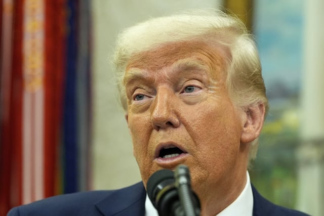 President Donald Trump speaks with reporters during a swearing in ceremony for Dr. Mehmet Oz to be Administrator of the Centers for Medicare and Medicaid Services, in the Oval Office of the White House, Friday, April 18, 2025, in Washington.