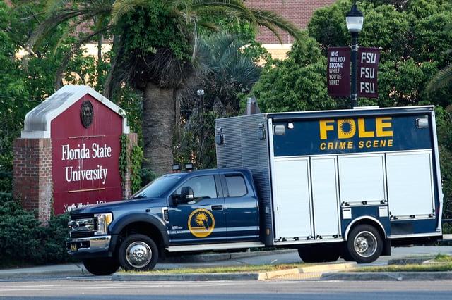 Crime scene vehicle at the Woodward Avenue entrance to the Florida State University campus after a shooting, in Tallahassee, Fla., Thursday, April 17, 2025. (AP Photo/Gary McCullough)