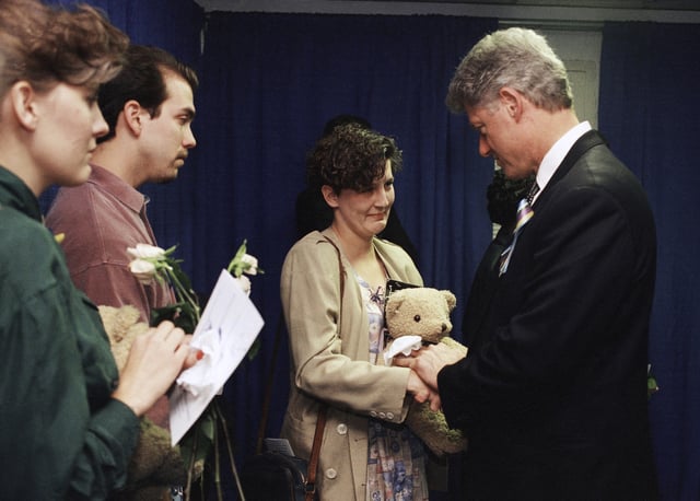 FILE - Aren Almon greets President Bill Clinton after a prayer service for the victims of the deadly truck bomb attack in Oklahoma City on April 23, 1995. (AP Photo/Pat Sullivan, File)