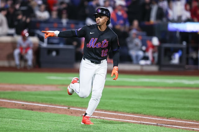 Apr 18, 2025; New York City, New York, USA;  New York Mets shortstop Francisco Lindor (12) hits a game winning solo home run in the ninth inning against the St. Louis Cardinals at Citi Field. Mandatory Credit: Wendell Cruz-Imagn Images