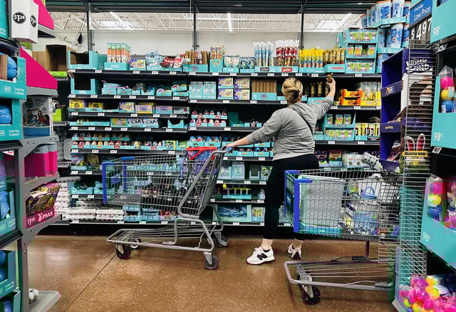 A woman shops at a Walmart in Rosemead, California, on April 11, 2025. Walmart, as a major retailer and a major importer of goods it sells to the American consumer, will be affected by the tariffs as estimates suggest some 70-80% of Walmart's products are sourced from China.