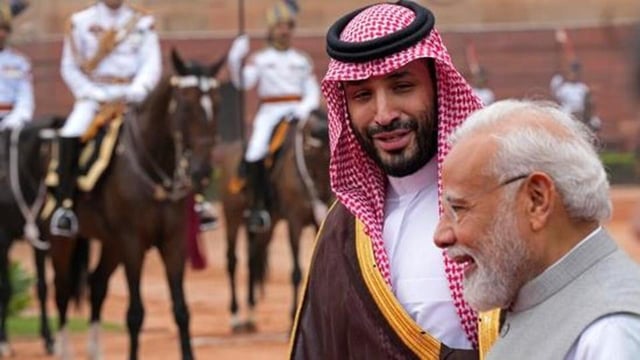 Crown Prince Mohammed bin Salman of Saudi Arabia speaks to Prime Minister Narendra Modi upon his arrival for a ceremonial reception at the presidential palace in New Delhi in April 2023. (AP File Photo)