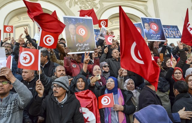 FILE - People take part in a protest against president Kais Saied policies, in Tunis, Tunisia, Sunday, March 5, 2023. (AP Photo/Hassene Dridi, File)