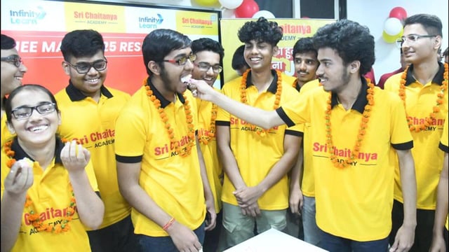 Students celebrating the JEE Main 2025 exam results in Patna on Saturday. (Santosh Kumar/ Hindustan Times)